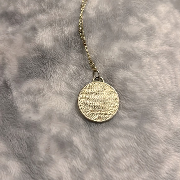 This is a gold elephant necklace with diamonds. - Picture 4 of 4